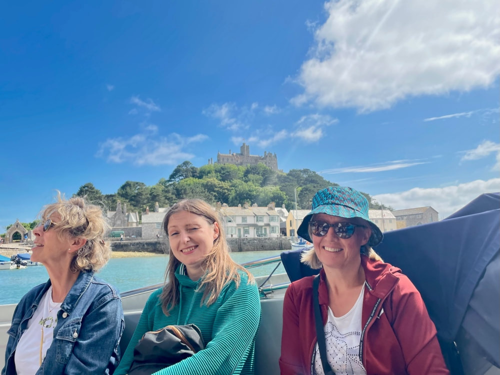 Adults enjoying the boat to St Michael's Mount